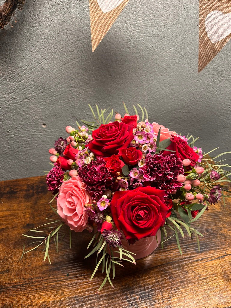 red and pink rose arrangement