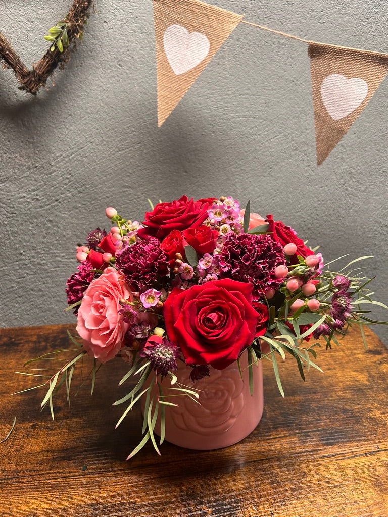 red and pink rose arrangement
