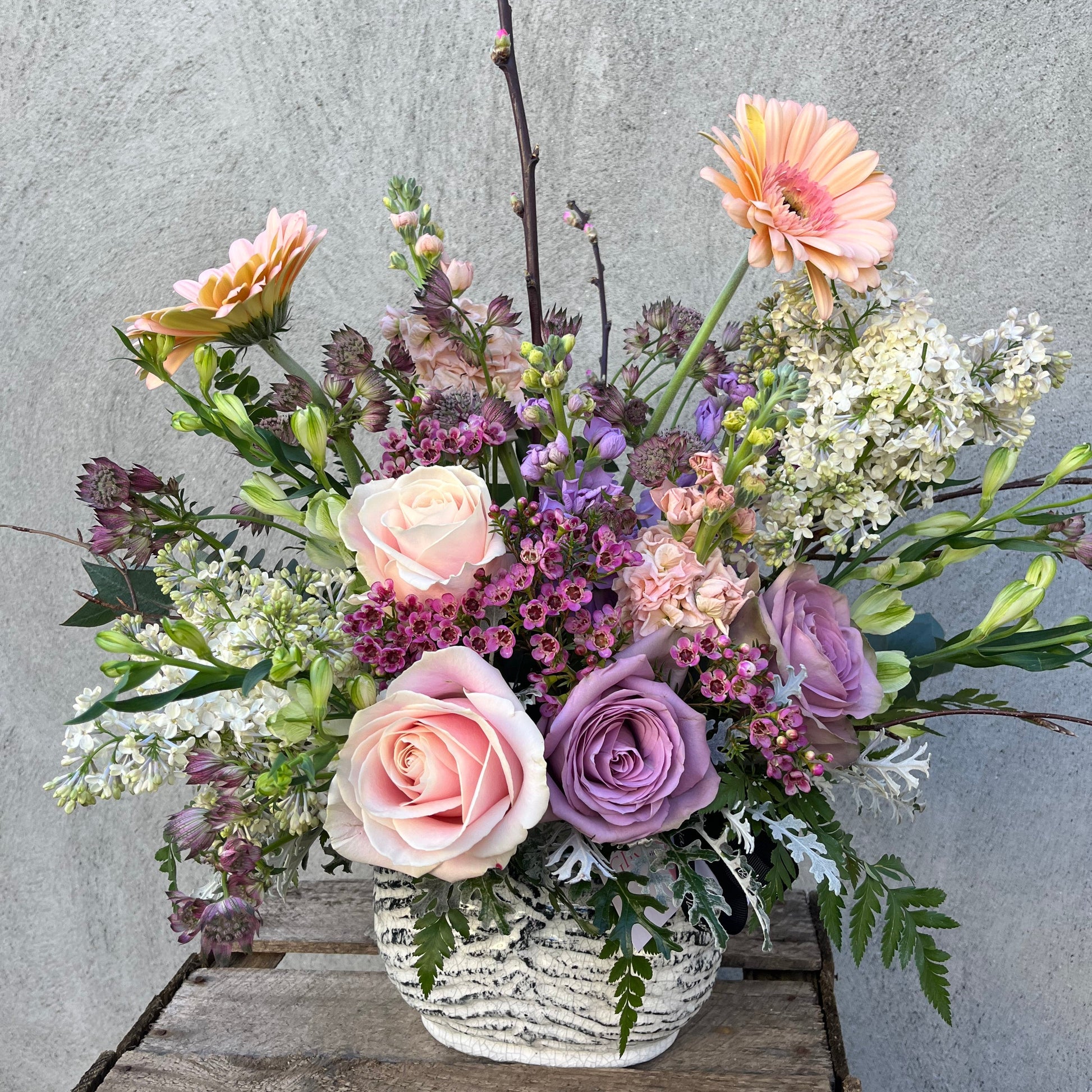 roses and gerbera in a flower arrangement